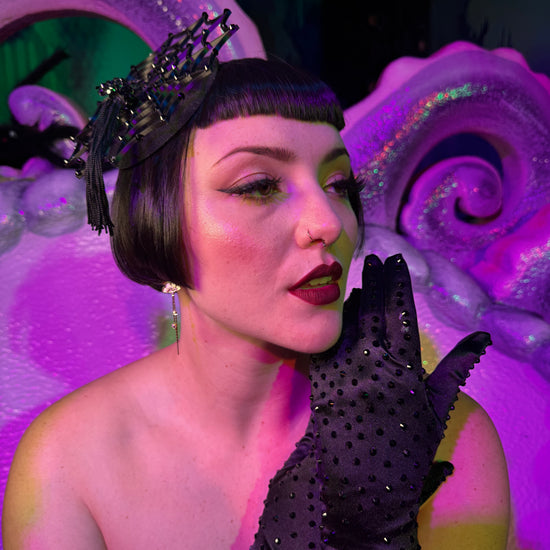 Cierra Bliss wearing classic short black rhinestone gloves with spider fascinator and black Elle Rebel spiderweb dress