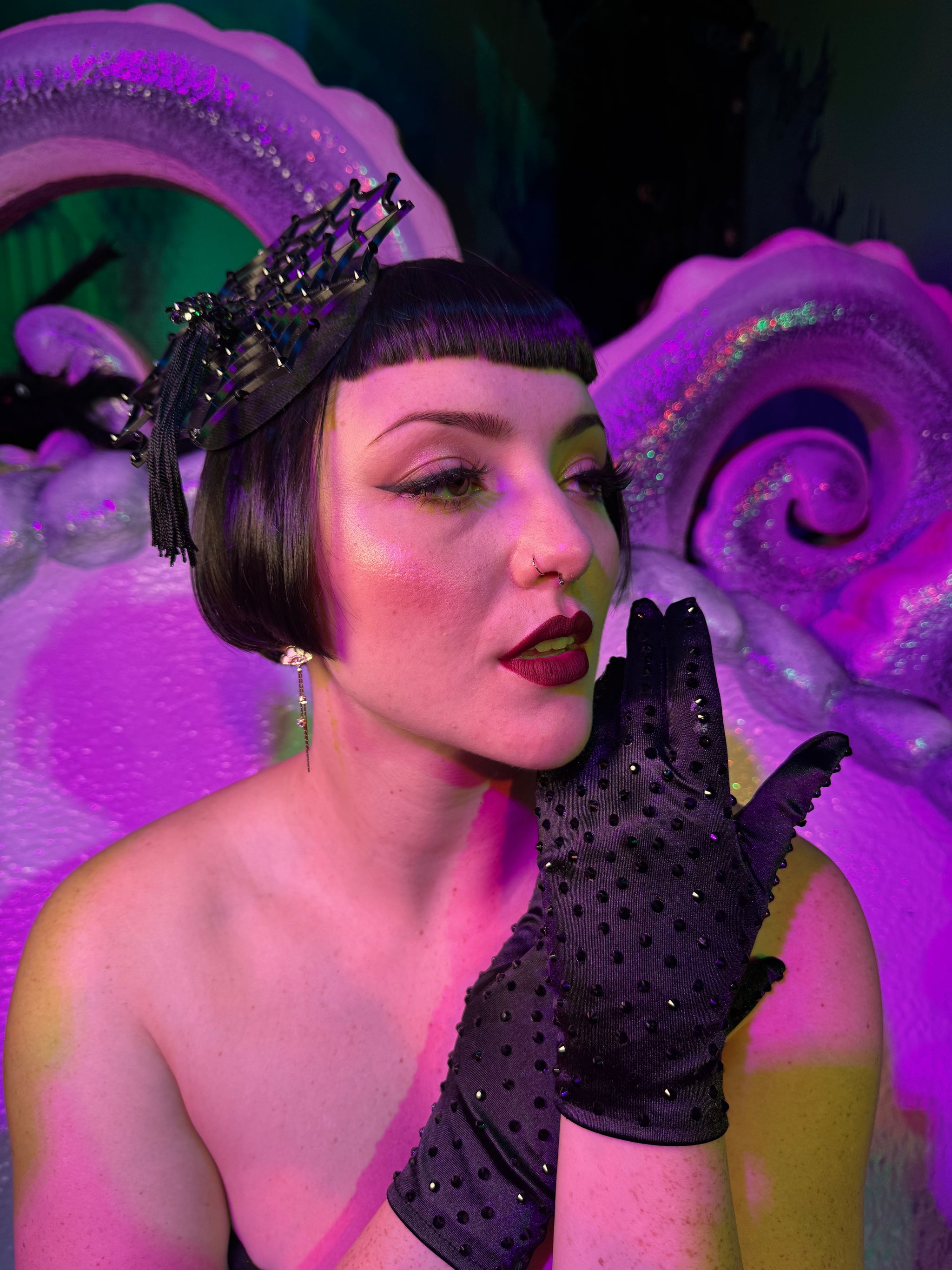 Cierra Bliss wearing classic short black rhinestone gloves with spider fascinator and black Elle Rebel spiderweb dress